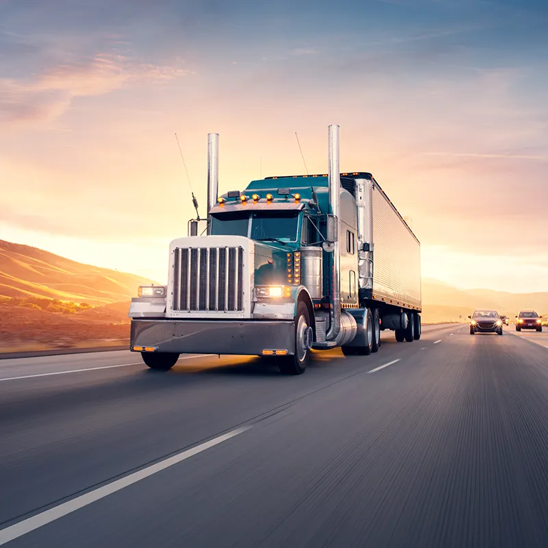 Semi-truck driving down highway