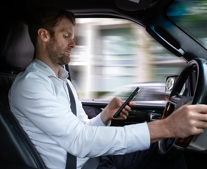 Man texting while driving