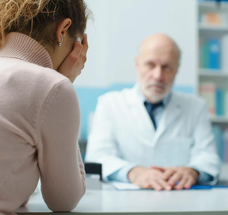 Doctor giving bad news to a woman