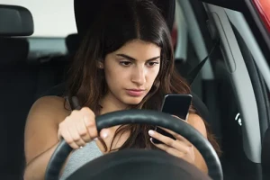 Woman distracted driving with phone