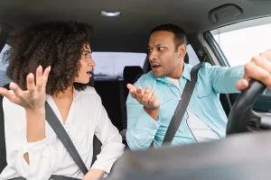Couple fighting in car